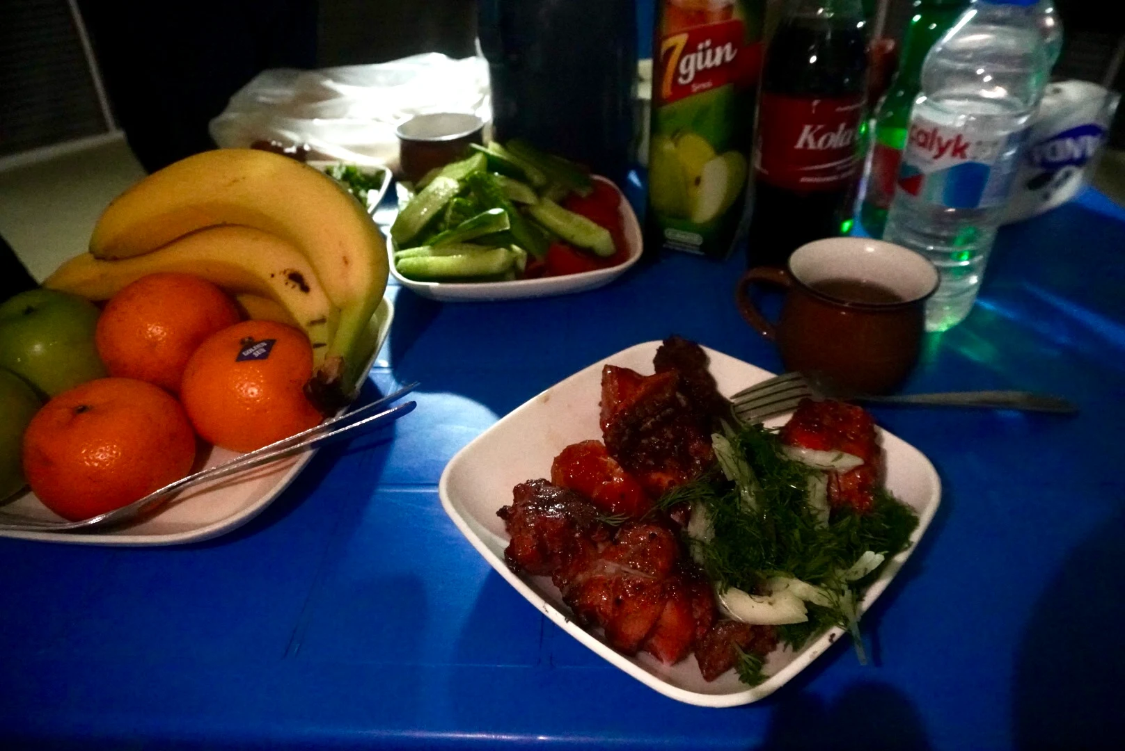 4 Day Turkmenistan Tour: Farab to Shavat via Merv, Ashgabat & Darvaza Traditional dinner at Darvaza yurt camp with grilled shashlik, fresh herbs, vegetables, fruit and drinks served to travelers