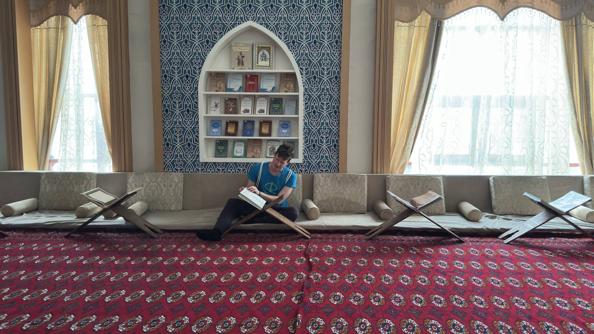 1 Day Turkmenistan Tour from Bukhara to Turkmenabat Traveler visiting a mosque and learning about the Quran during a Turkmenabat city tour