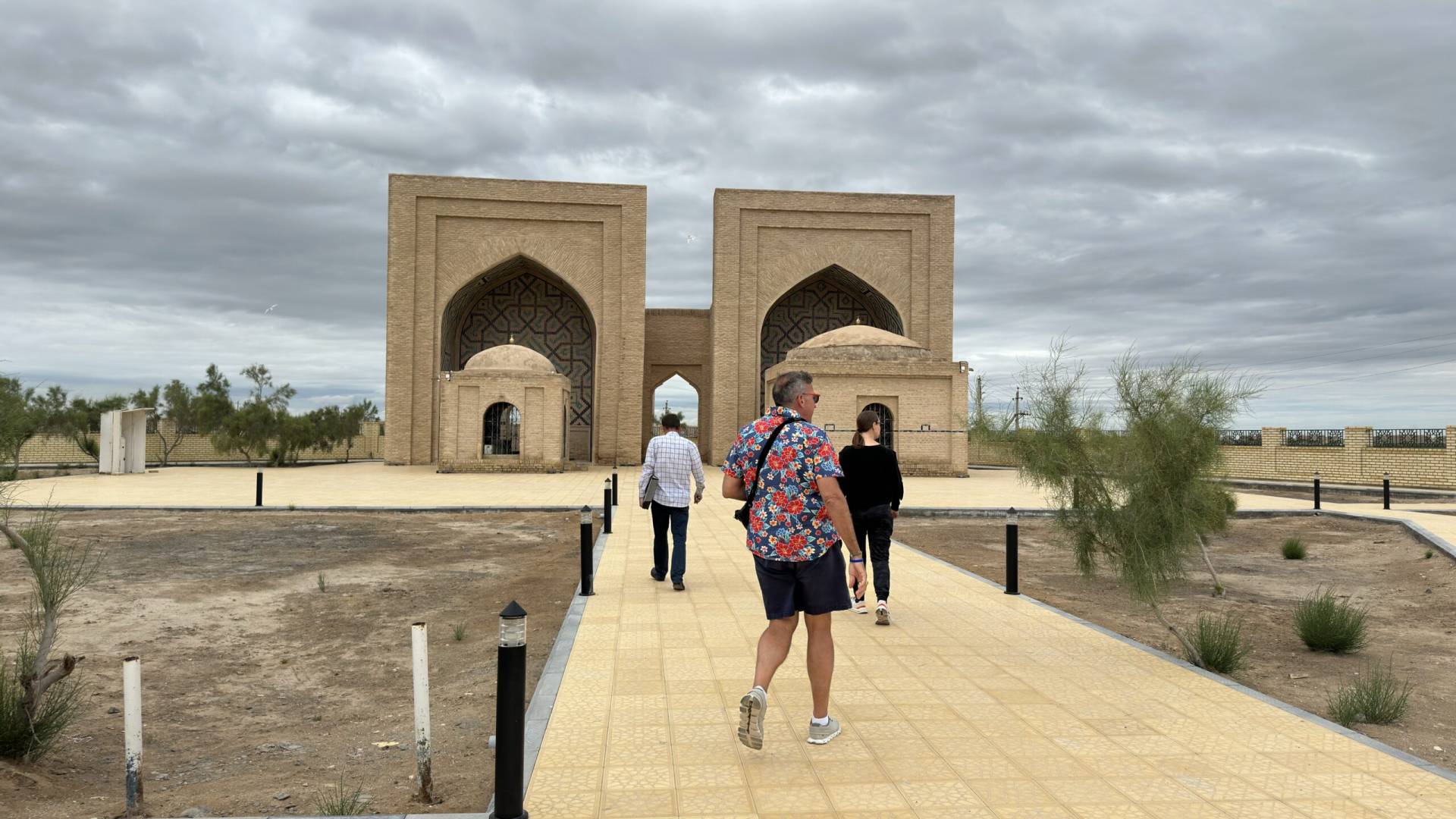 4 Day Turkmenistan Tour: Farab to Shavat via Merv, Ashgabat & Darvaza American tourists and archaeologist Viktor approaching the Yusuf Hamadani Mosque and Mausoleum in Ancient Merv