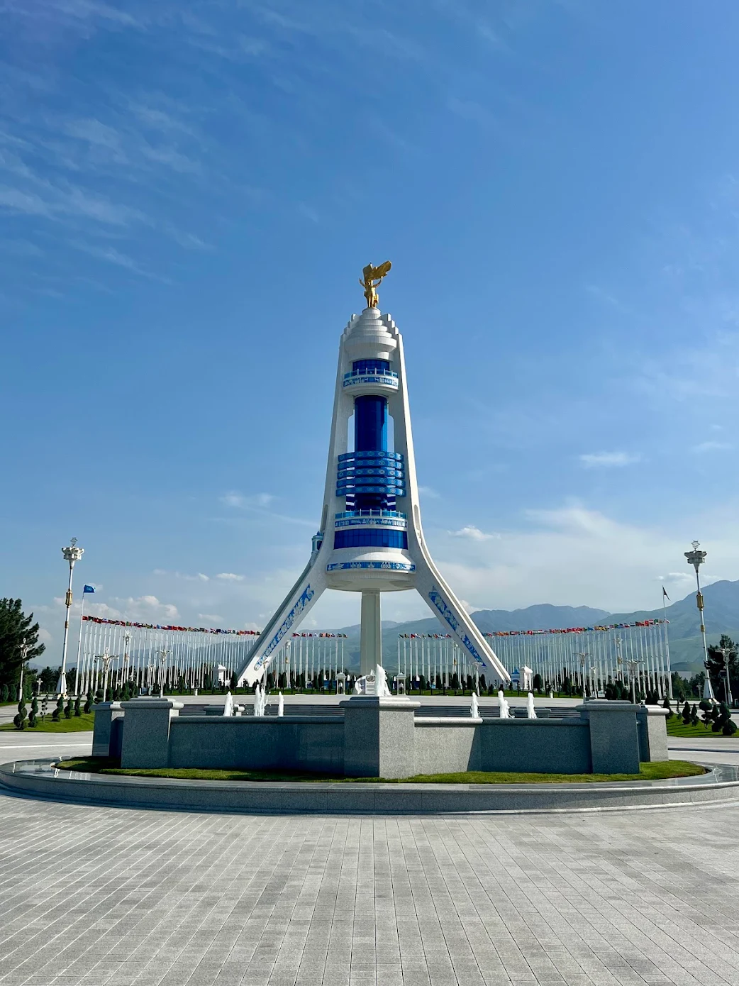 3 Day Turkmenistan Tour from Ashgabat: Darvaza & Night Train to Bukhara Monument of Neutrality in Ashgabat with the golden statue of Saparmurat Niyazov rising above fountains and landscaped grounds
