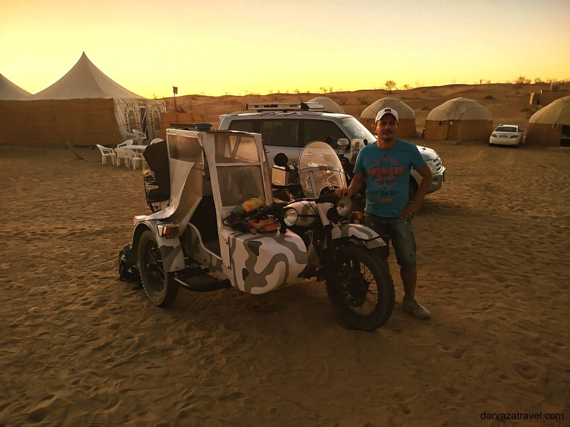 Darvaza Yurt Camp Three-wheeled motorcycle with enclosed sidecar parked at Darvaza Yurt Camp