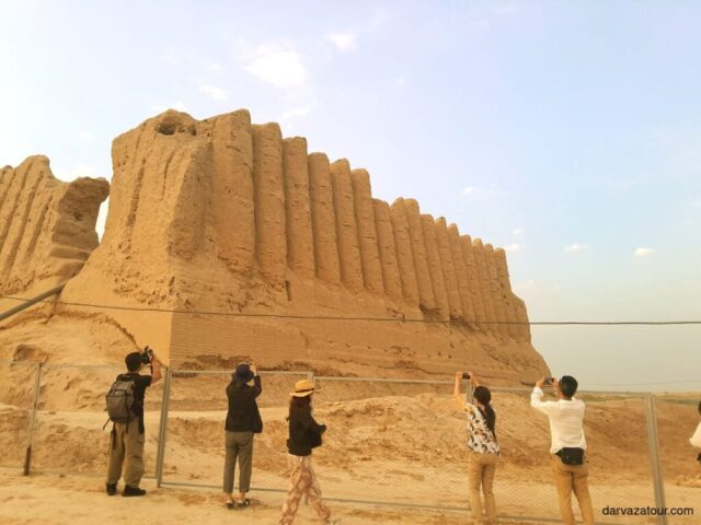 Tourists photographing the ancient ruins of Merv, a UNESCO World Heritage site in Turkmenistan