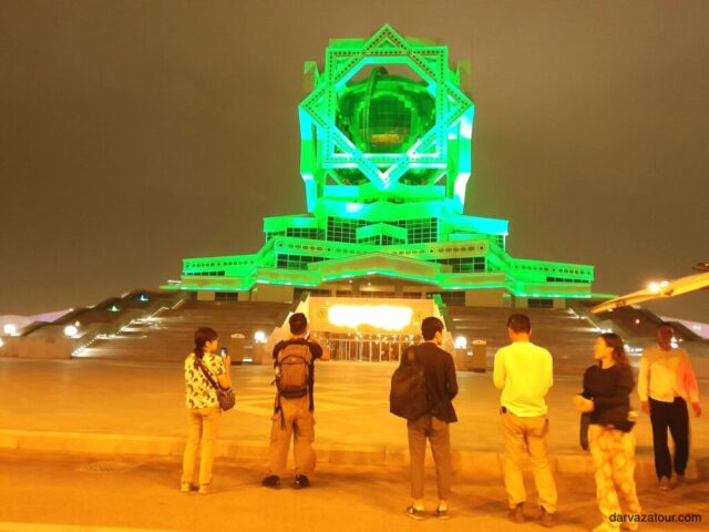 Bagt Kosgi Hotel Ashgabat Turkmenistan 4-star luxury accommodation illuminated green lighting night tourism landmark architectural monument tourist destination central asia