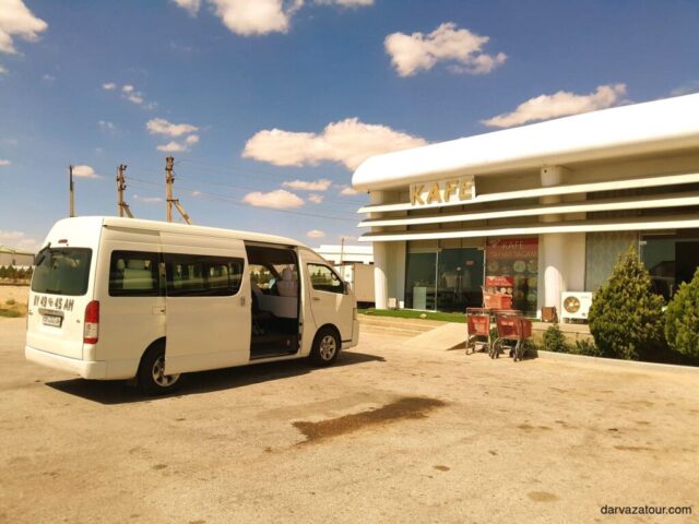 Tour van parked at roadside cafe in Jebel, Turkmenistan after 430km journey where tourists enjoyed Gowurma and Palaw dishes