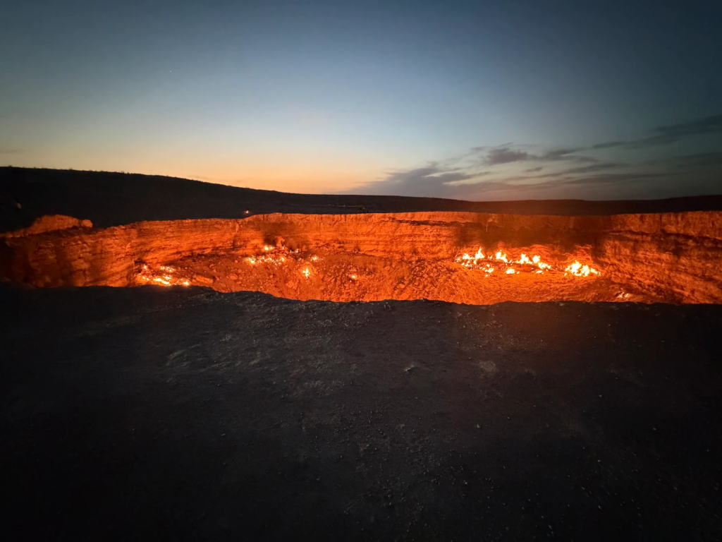 Darvaza Gas Crater at Sunset Darvaza Gas Crater glowing with natural gas flames during sunset in the Karakum Desert of Turkmenistan