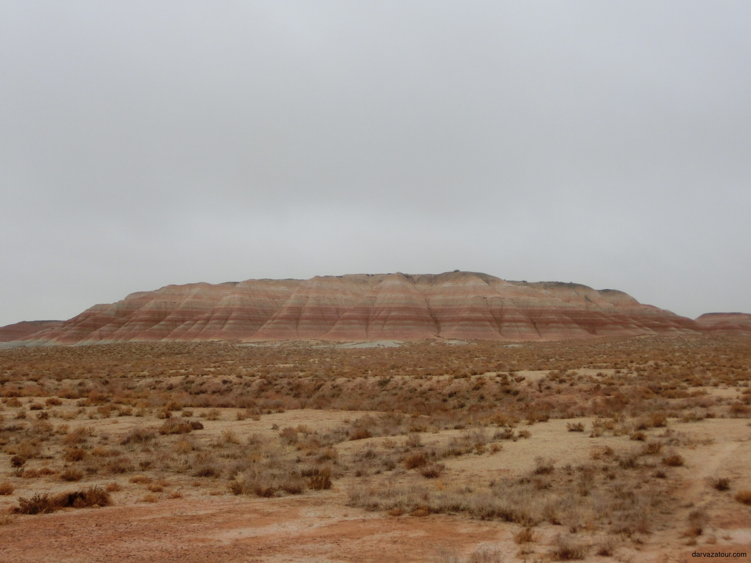 Yangikala Canyon in winter, colorful striped cliffs in Turkmenistan desert landscape