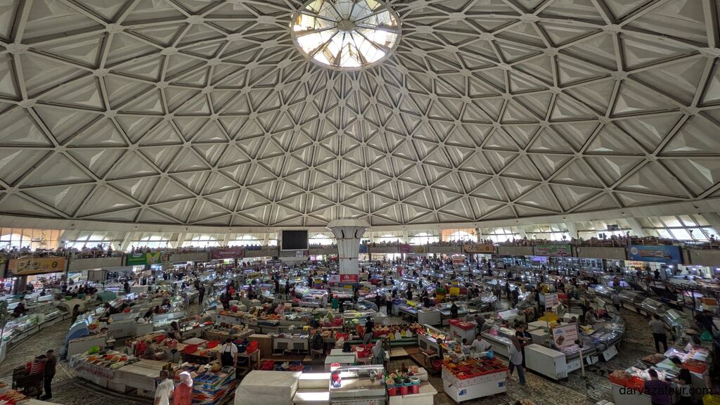 Inside Chorsu Bazaar in Tashkent, Uzbekistan – traditional market under a giant dome with stalls of fruits, spices, and local products