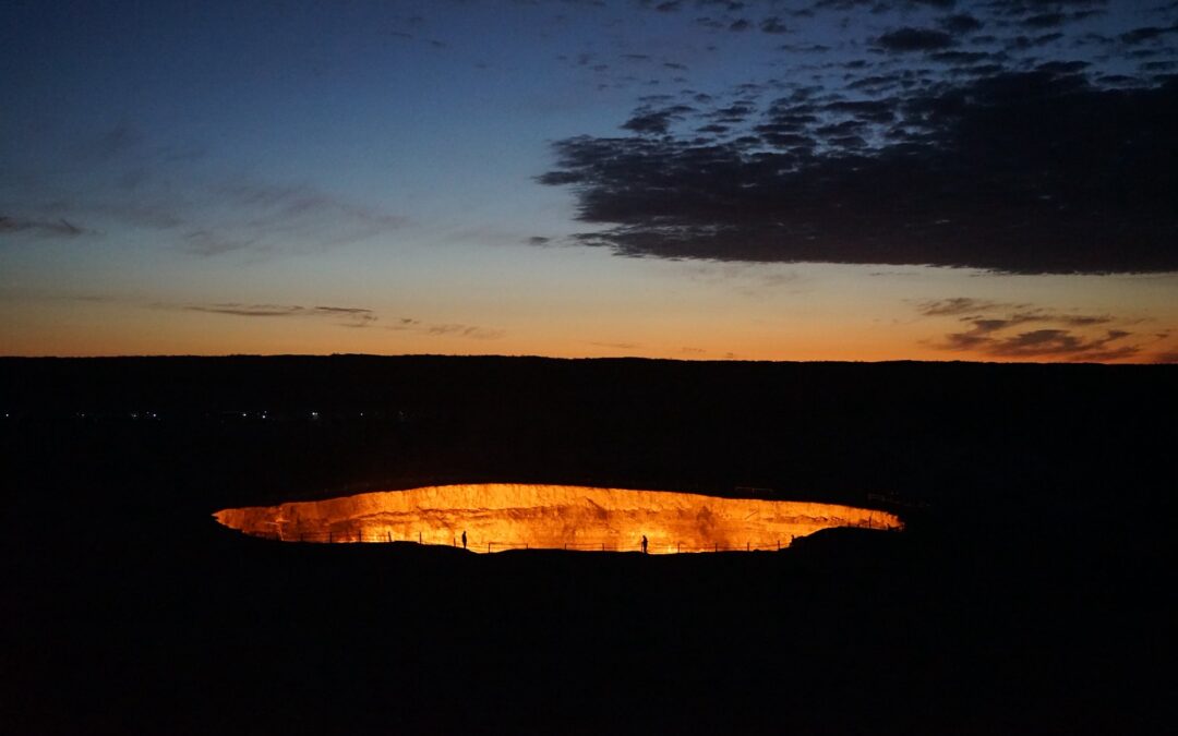Darvaza Gas Crater glowing at sunrise in the Karakum Desert