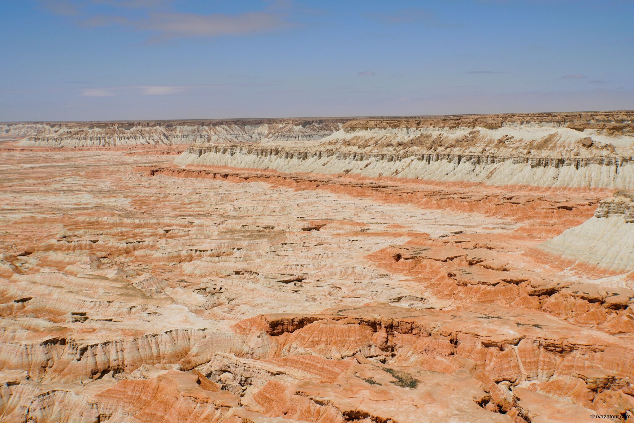 Yangikala Canyon in summer heat, stunning red and white cliffs in Turkmenistan desert near Caspian Sea and Kazakhstan border