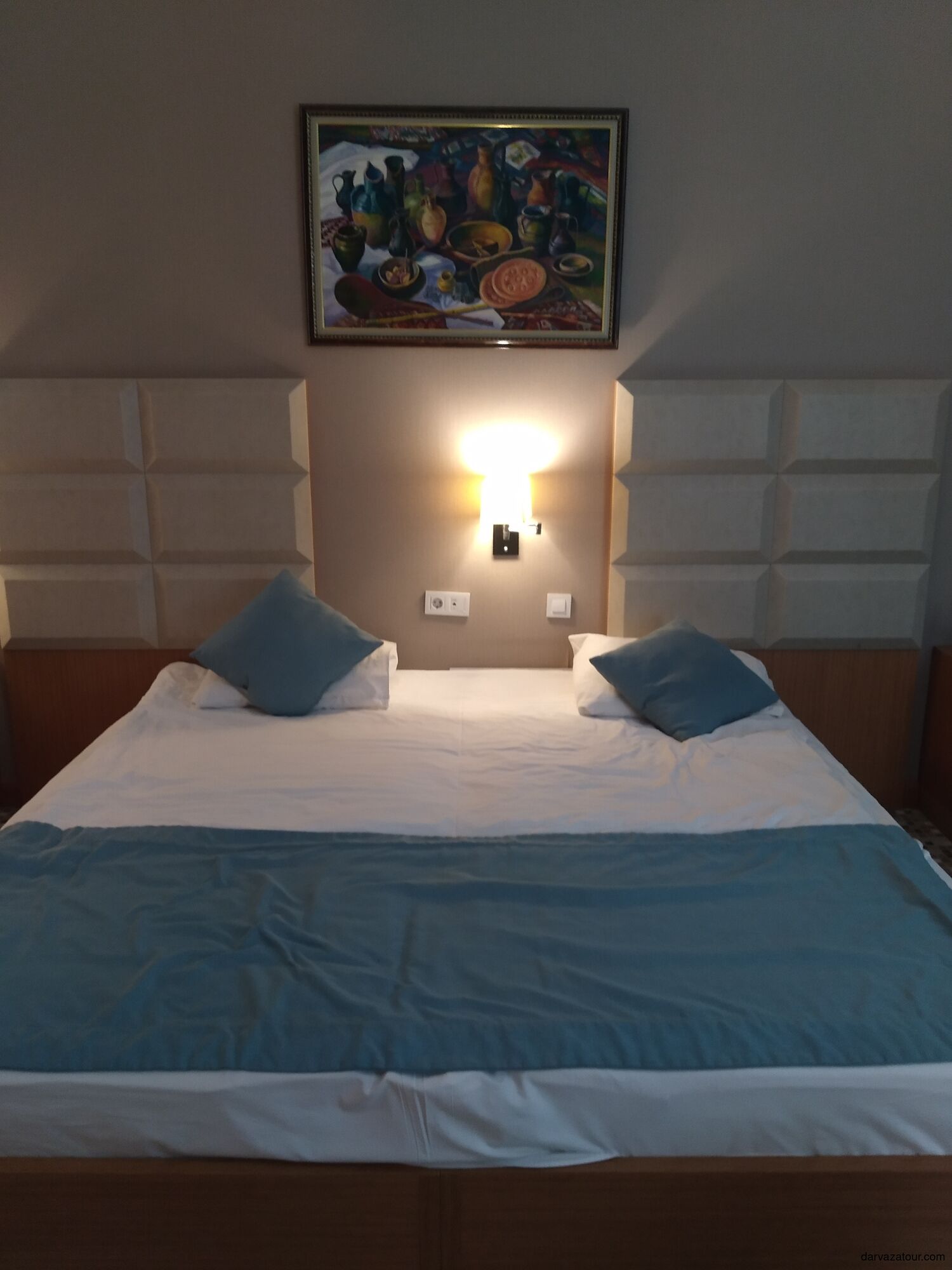 Comfortable double bed in BQPQL Hotel Turkmenbashi, a clean and modern three-star hotel near the Caspian Sea, popular among travelers arranged by Darvaza Tour.