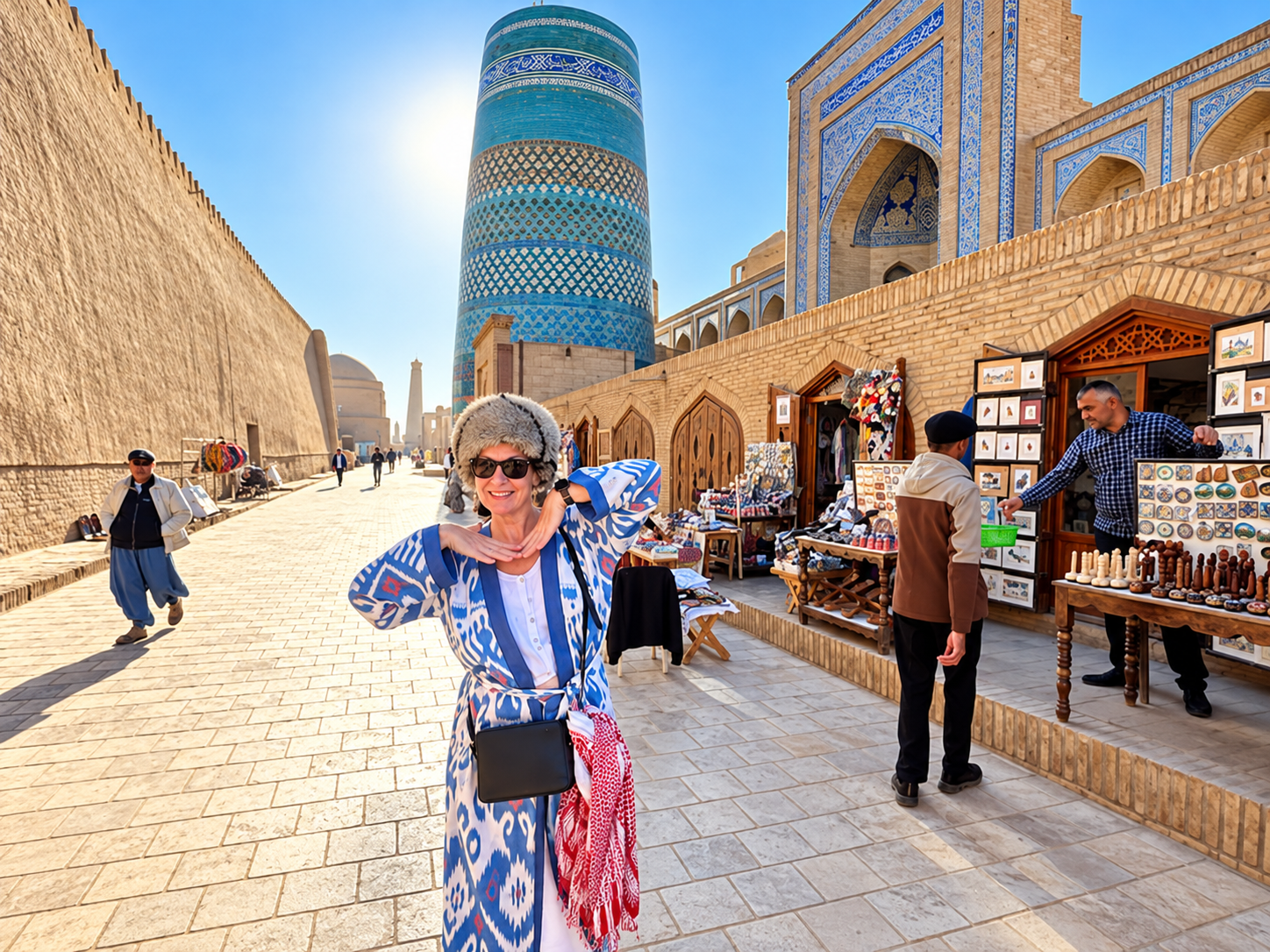Group of tourists exploring white marble buildings and monuments in Ashgabat, Turkmenistan during a guided tour