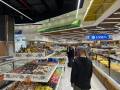 3 Day Turkmenistan Tour from Ashgabat: Darvaza & Night Train to Bukhara Ashgabat supermarket — tourist experiencing local market life.