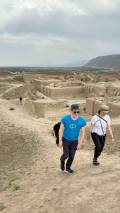 3 Day Turkmenistan Tour from Ashgabat: Darvaza & Night Train to Bukhara Tourists Exploring Ancient Nisa near Ashgabat