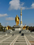 3 Day Turkmenistan Tour from Ashgabat: Darvaza & Night Train to Bukhara Saparmurat Niyazov Statue at Independence Monument