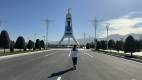 4 Day Turkmenistan Tour: Farab to Shavat via Merv, Ashgabat & Darvaza Guide Aiza at the Monument of Neutrality in Ashgabat