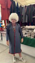 1 Day Turkmenistan Tour from Khiva: Dashoguz & Kunya-Urgench American Tourist Wearing Traditional Turkmen Telpek